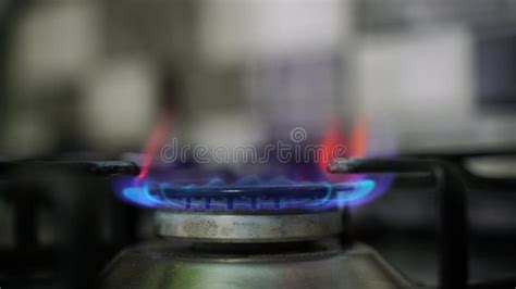 Kitchen Burner Turning On Stove Top Burner Igniting Into A Blue