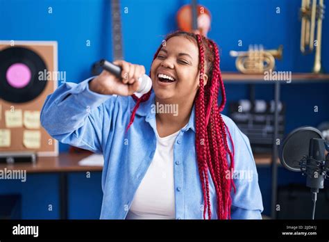 African american woman artist singing song at music studio Stock Photo