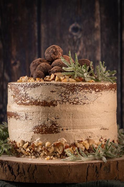 Delicious Naked Chocolate And Hazelnuts Cake On Table Rustic Wood Kitchen Countertop Stock Image