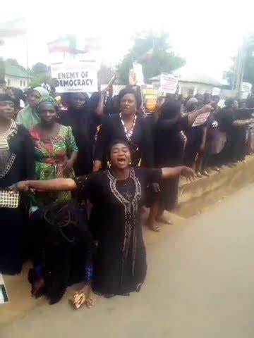 Youths At INEC Headquarters With Some Women Protesting Naked Rolling