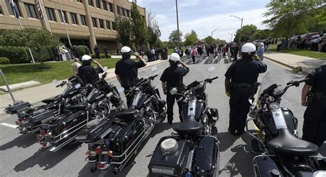 Members Of The Independence Police Department Motorcycle Unit Salute