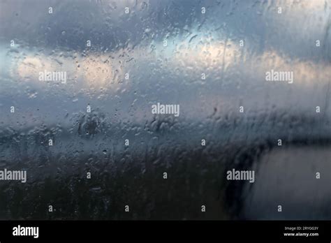 Rain Drops Water On Car Window View From Surface Out Of Glass Window