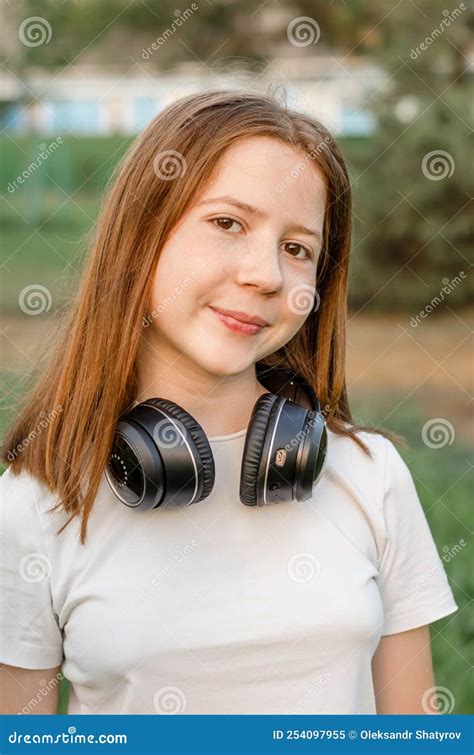 Portrait Of A 12 Year Old Red Haired Teenage Girl In Nature Stock Image