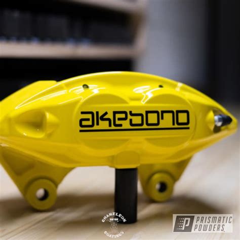 Akebono Brake Calipers done in Yes Yellow | Prismatic Powders