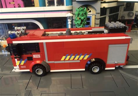 A Lego Fire Truck Is On Display In A Toy Store