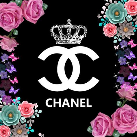 The Chanel Logo Surrounded By Pink Roses And Blue Flowers On A Black