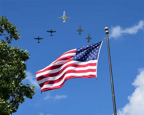 A Five Ship Formation Performs A Flyover During A Memorial NARA