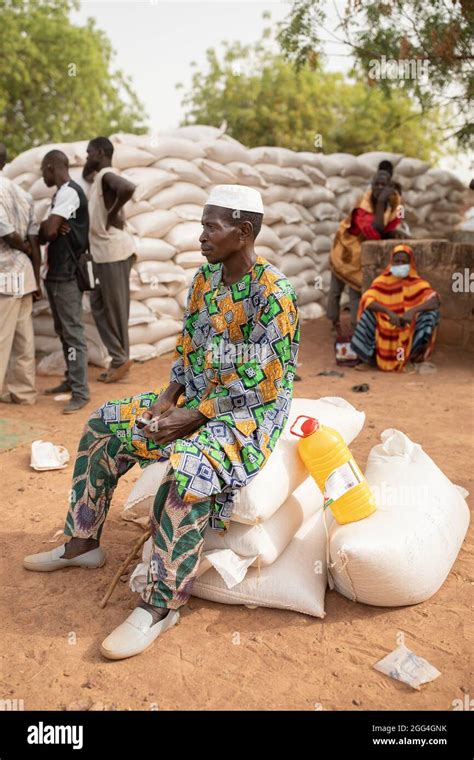 Sacks And Bags Of Food And Grain Are Distributed To Women And Men Affected By Conflict In