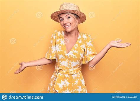 Beautiful Blonde Woman On Vacation Wearing Summer Hat And Dress Over