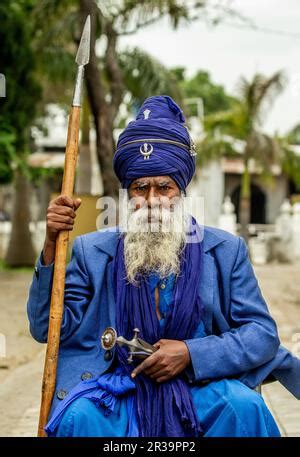 Portrait of a Sikh warrior in traditional dress with weapons Stock ...