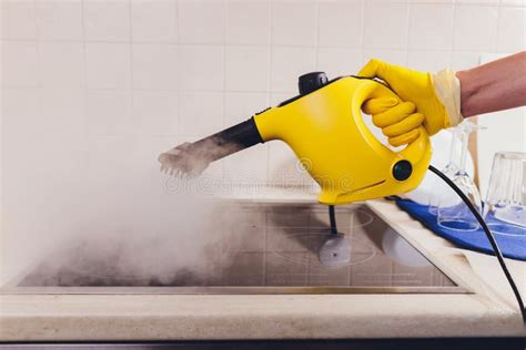 Cleaning Kitchen Hob with a Steam Cleaner. Stock Image - Image of home ...