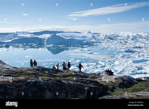 Tourists admiring Ilulissat Icefjord, Ilulissat (Jakobshavn), Greenland Stock Photo - Alamy