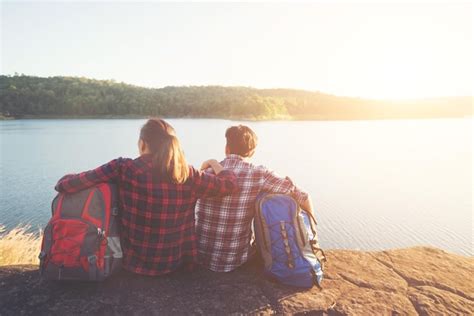 Premium Photo Rear View Of Male And Female Hikers With Backpacks