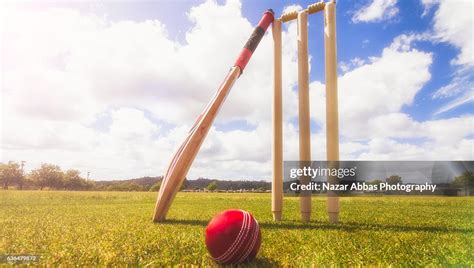 Cricket Bat Ball And Wickets In Cricket Ground High Res Stock Photo