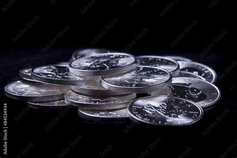 Pile of silver coins. Stock Photo | Adobe Stock