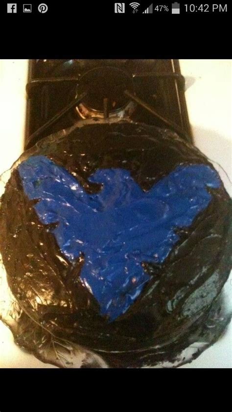 A Chocolate Cake With Blue Frosting In The Shape Of A Heart