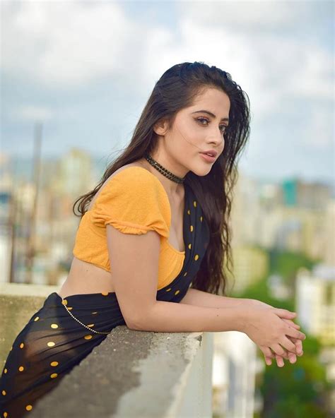 Urfi Javed Looks Sizzling Sexy Avatar In Low Waist Black Saree With Yellow Blouse See Latest