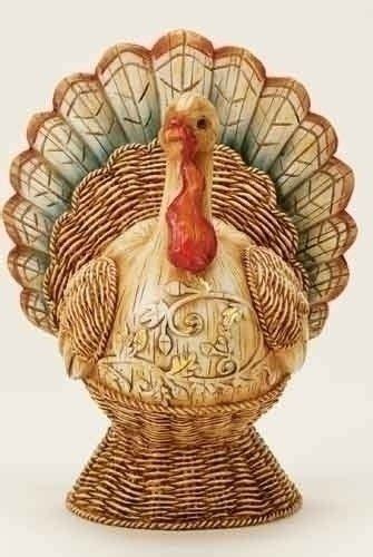 A Turkey Figurine Sitting On Top Of A Table