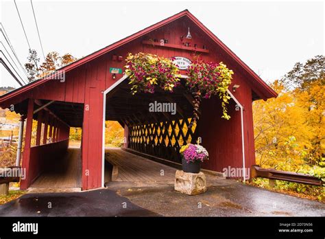 Beautiful Vermont covered bridge surrounded by colorful fall foliage ...