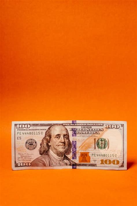 Paper Money on a White Surface · Free Stock Photo