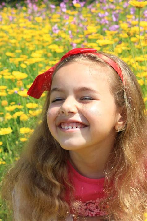 Happy Girl Smiling in a Yellow Flowers Garden Stock Image - Image of ...