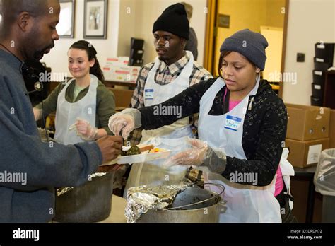 Detroit Michigan Volunteers Serve A Meal To The Homeless And Low