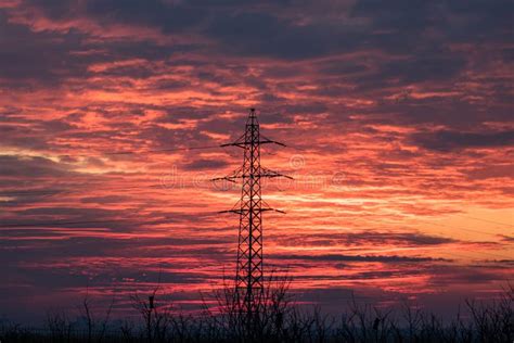 Silhouettes Of Transmission Tower Electricity Pylon Trees On Dramatic