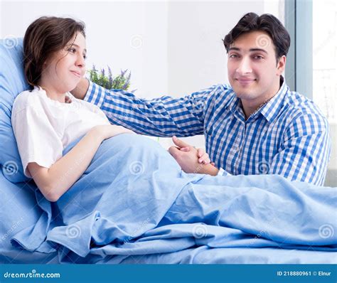 Caring Loving Husband Visiting Pregnant Wife In Hospital Stock Image