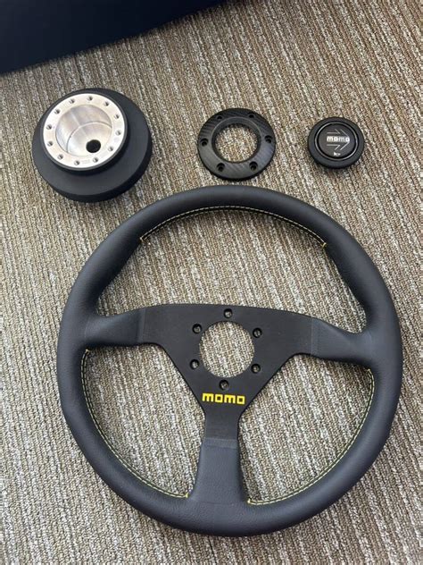 【未使用に近い】未使用momo ステアリング ホーンボタンリングカーボン柄 ワークスベル 日産車エアバック車用 ラフィックス専用ショートボス