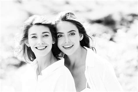 Premium Photo Portrait Of Two Cheerful Young Women Standing Together