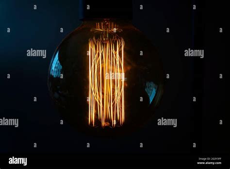 Close Up Of A Glowing Incandescent Light Bulb Filaments Stock Photo Alamy