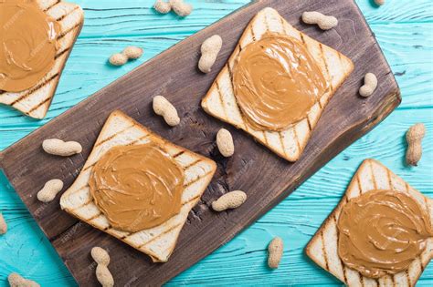 Premium Photo Peanut Butter Sandwiches Or Toasts On Wooden Background