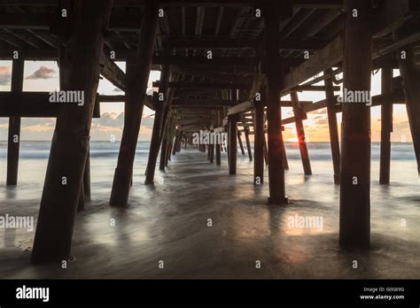 Under the San Clemente pier at sunset Stock Photo - Alamy