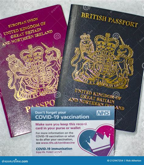 COVID-19 Vaccine Card and British Passport Editorial Stock Image