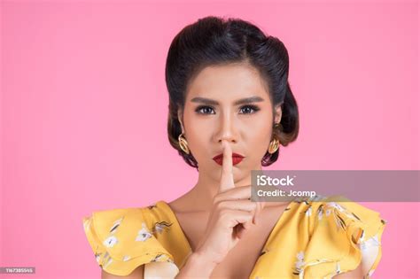 Beauty Asian Woman Red Lips And Finger Showing Hush Silence Sign Stock