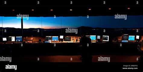 Panorama view from inside an air traffic control tower taken at night ...