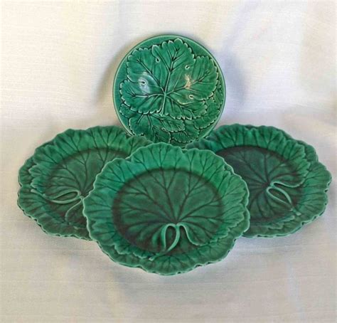 Three Green Plates Sitting On Top Of A White Sheet