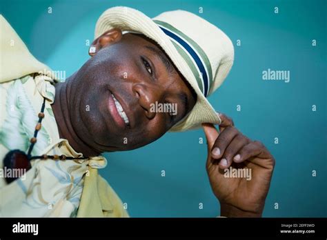 Portrait Of A Mature Man Tipping His Hat Stock Photo Alamy