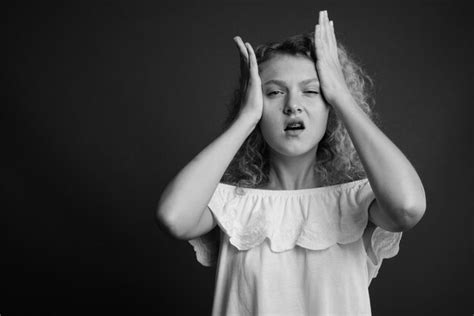 Premium Photo Portrait Of Girl Standing Against Black Background