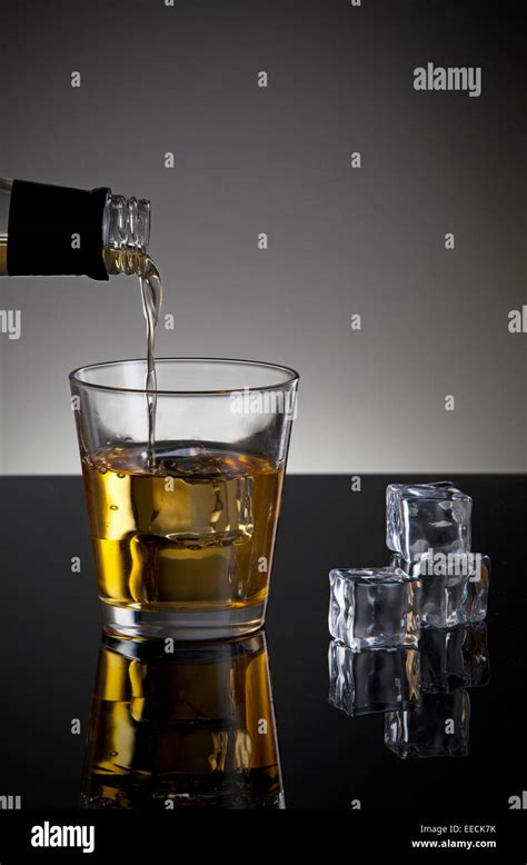 Whiskey Pouring Into Glass Close Up Shoot Stock Photo Alamy