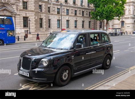 Hackney Carriage Antique Black Taxi Cab On Parliament Street In City Of