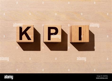 Kpi Acronym For Key Performance Indicator Letters On Cube Blocks On