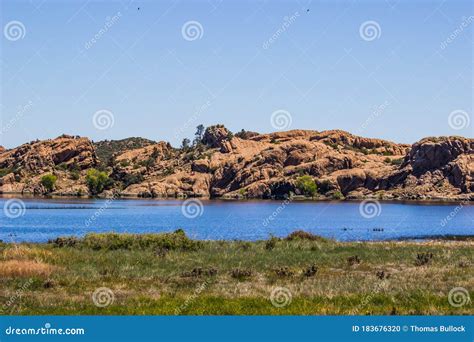 Giant Boulders On Shoreline Of Small Lake Stock Photo Image Of Lake