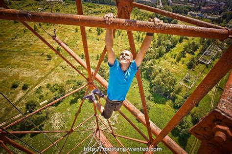 Ukrainian Daredevil Hangs From Tall Buildings In Frightening Photos