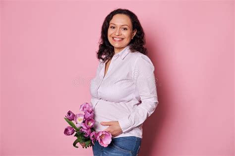 Positive Pregnant Woman Touching Belly Smiling Looking At Camera