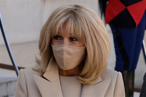 Brigitte Macron Complements Her Monochrome Shift Dress And Peacoat With