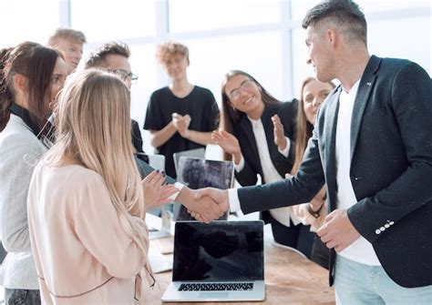 Premium Photo Happy Employees Congratulating Each Other On Their Success