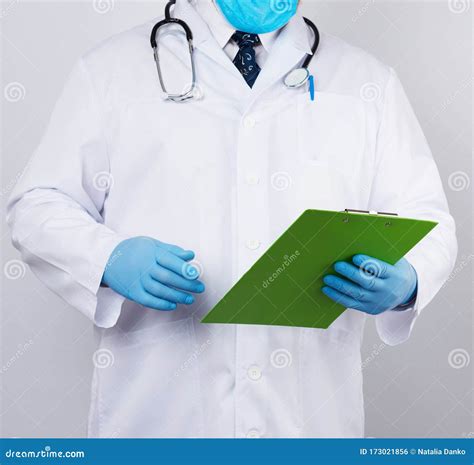 Male Doctor In A White Coat Blue Latex Gloves Stethoscope Hanging On