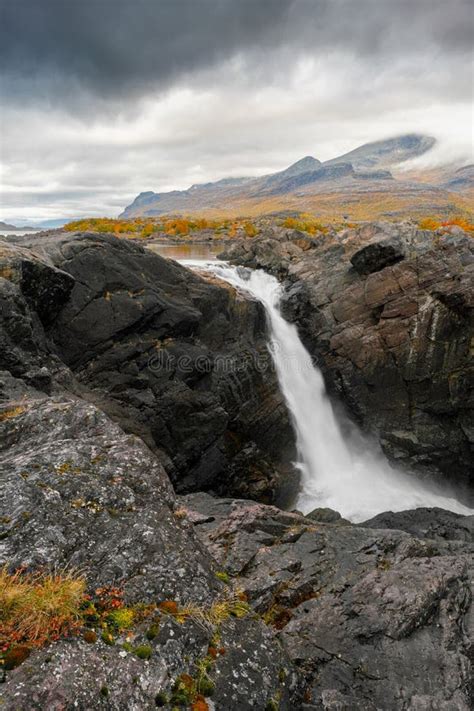 Mighty Scenic Waterfall Under Dramatic Sky. Stuor Muorkke Waterfall in ...