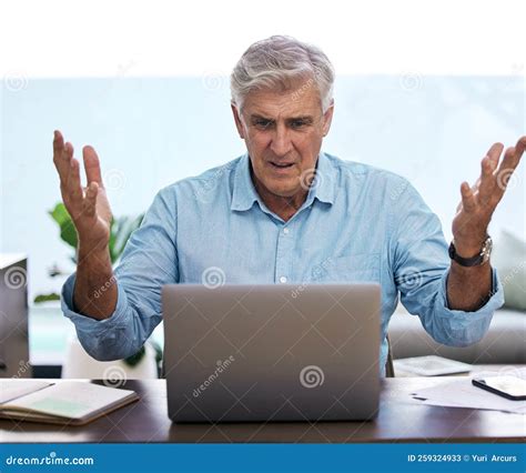 What Is This Laptop Doing A Mature Man Sitting Alone And Feeling Frustrated While Using His